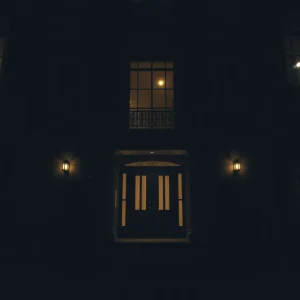 A tense and dark atmosphere of a luxurious townhouse related to a disturbing kidnapping case.