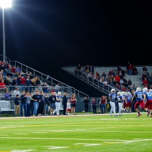 Austin High School football players in a game under the lights