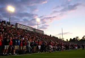 High school football players in action during a night game