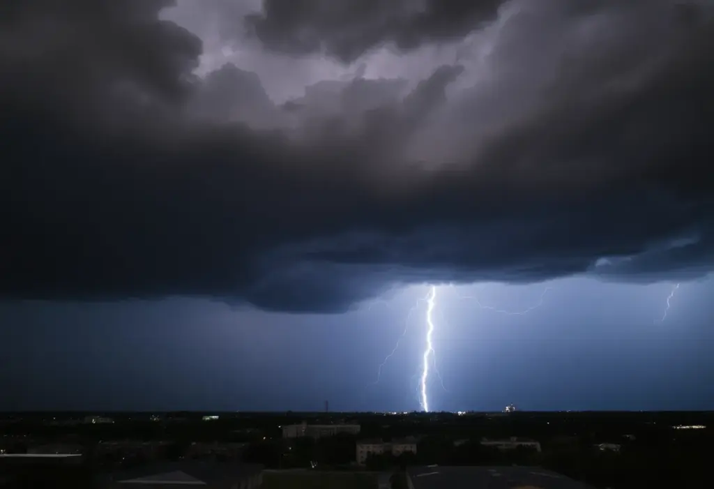 Dark storm clouds and lightning over the city of Austin during a thunderstorm.