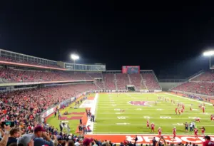 Fans cheering in Westlake High School stadium during the football game against Austin High School.