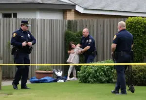 Police rescuing a captive woman in Austin backyard