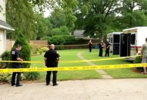 Police investigating a backyard crime scene in Austin Texas
