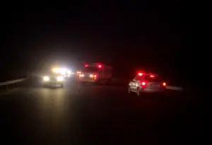 Scene of a fatal DUI crash on a Texas highway with emergency vehicles
