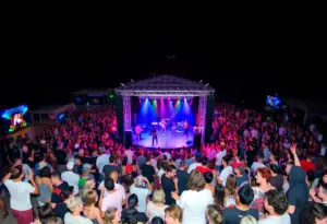 Crowd at Forrest Frank's concert with an in-the-round stage setup
