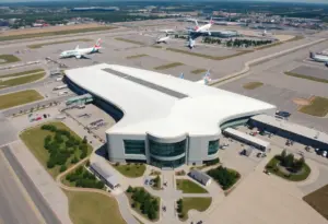 An aerial view of Austin-Bergstrom International Airport filled with travelers and showcasing its unique amenities.