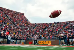 Crowd cheering at a college football playoff game.