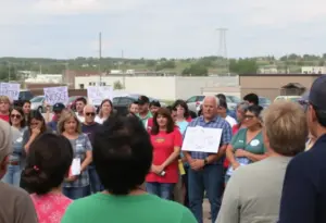Community residents in Hays County discussing immigration enforcement concerns.