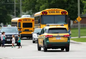Self-driving vehicle passing a stopped school bus in an Austin school zone